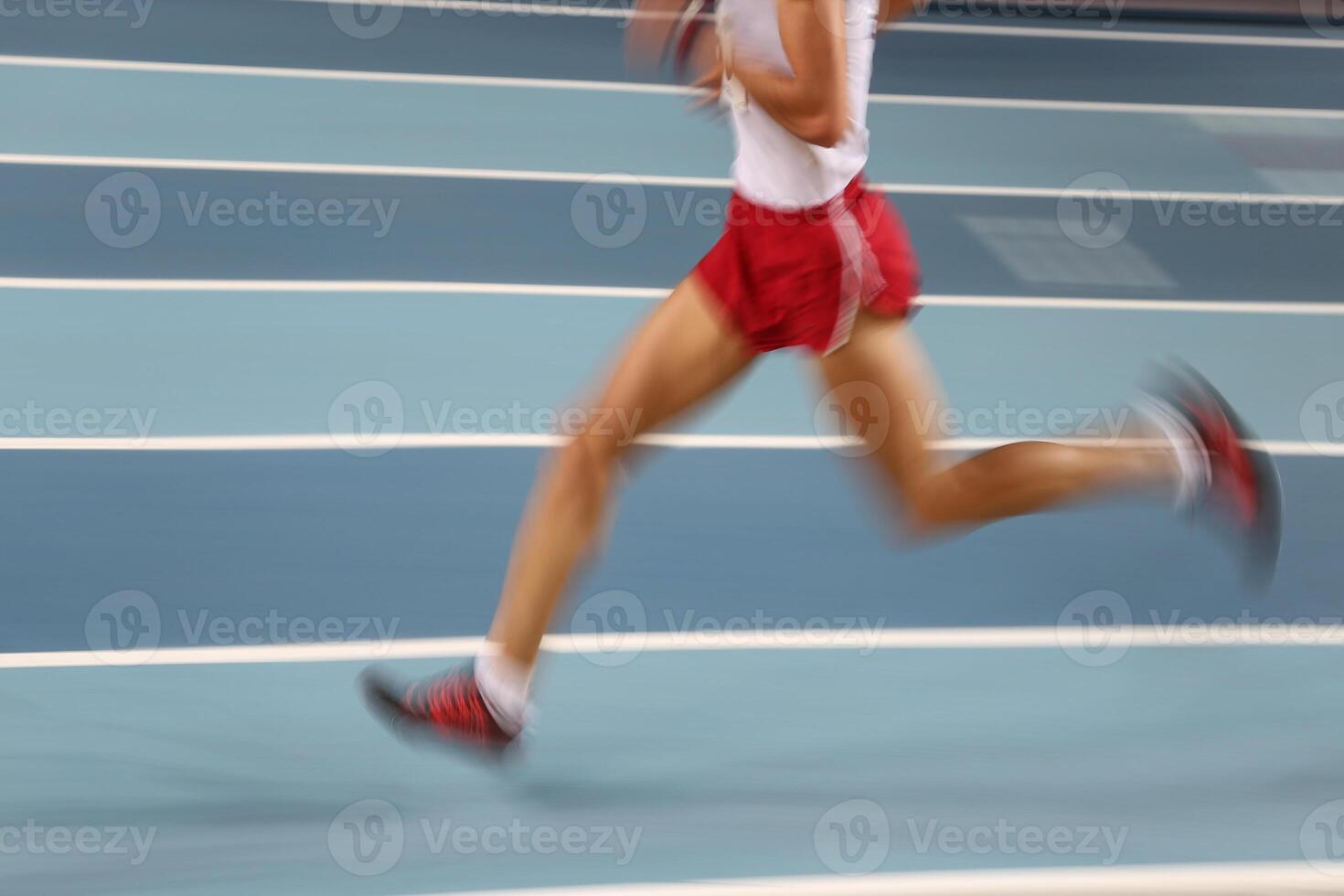 Blured athletes running photo