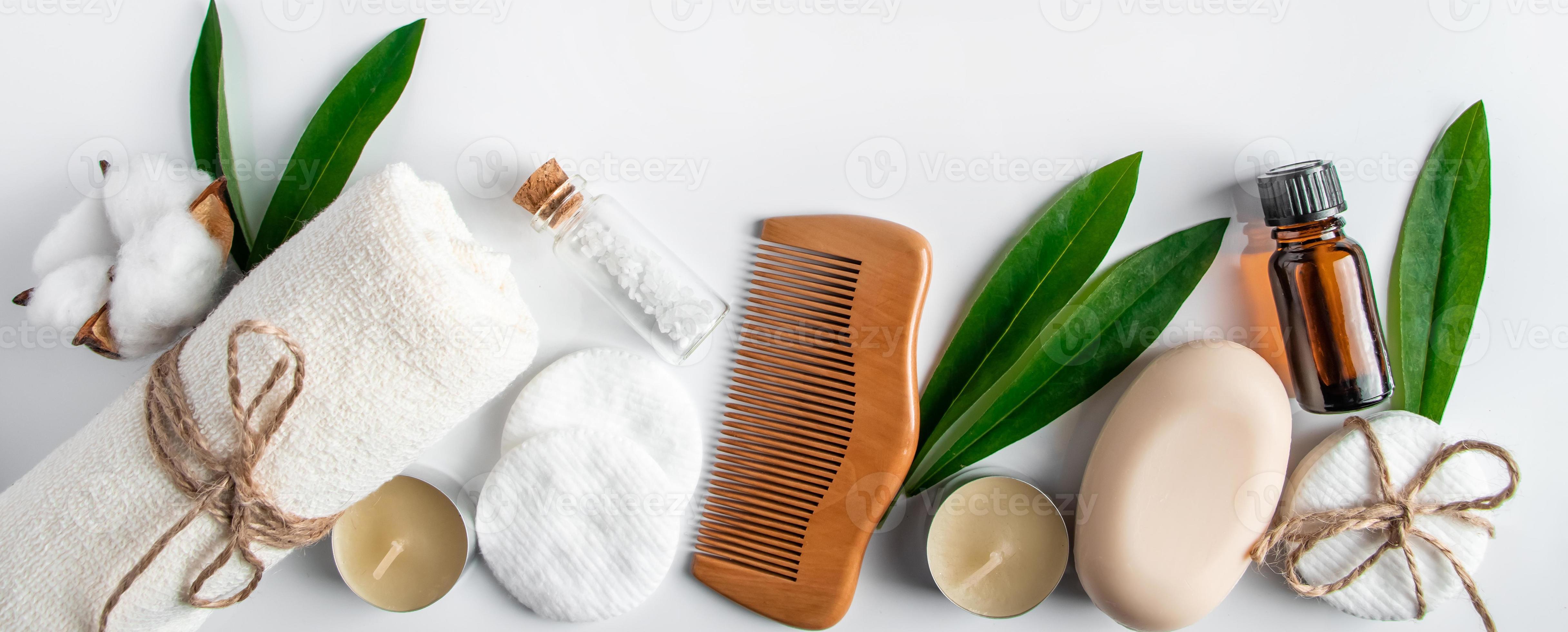 Spa body care accessories on white background Towel hairbrush