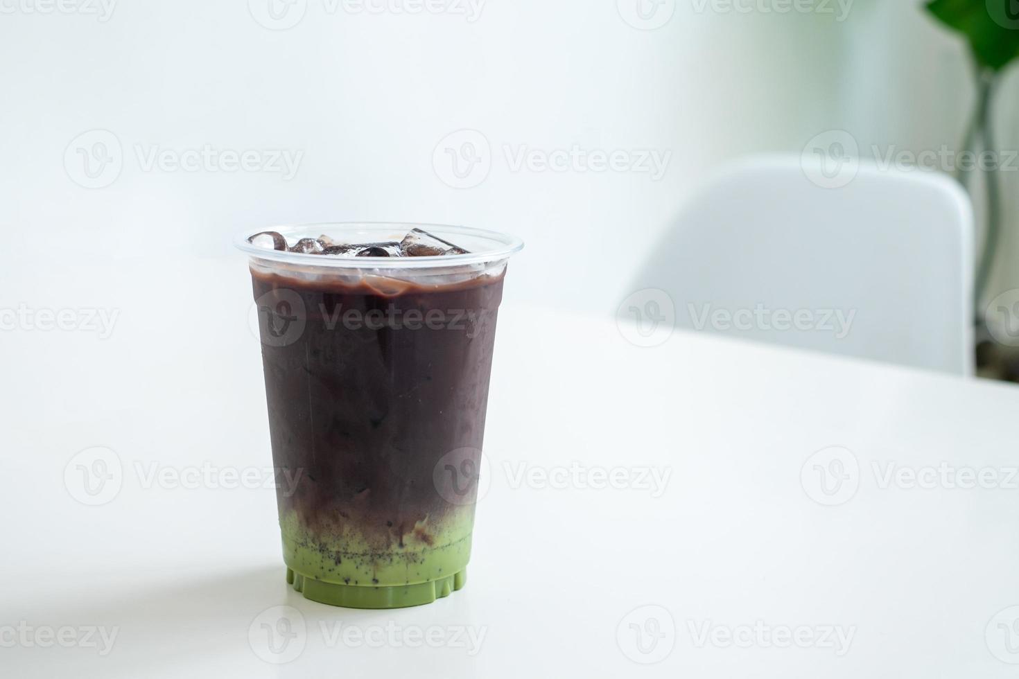 coco,iced chocolate in the cup on white table in coffee shop, concept food, drink and health, copy space photo