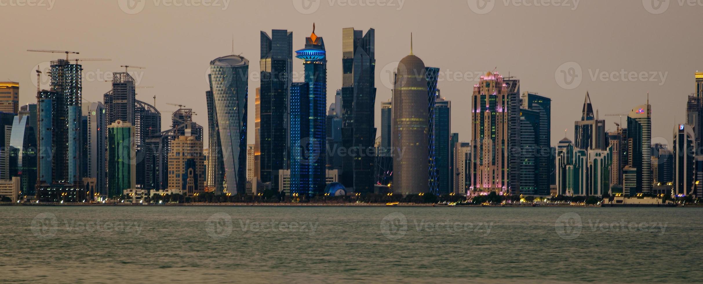 Doha skyline from Corniche daylight panoramic view showing West Bay skyscrapers photo