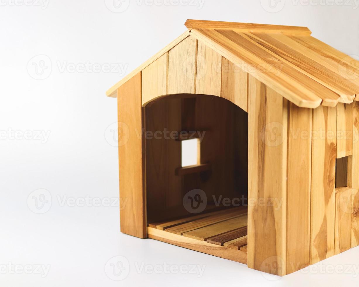 Empty wooden dog's house on white background. Isolated. photo