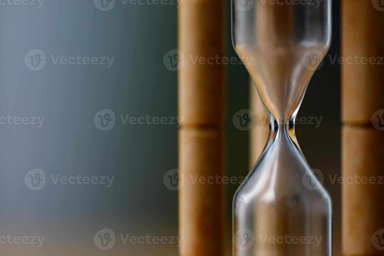 Close-up Vintage Wooden Hourglass with empty sand, Time is up concept photo