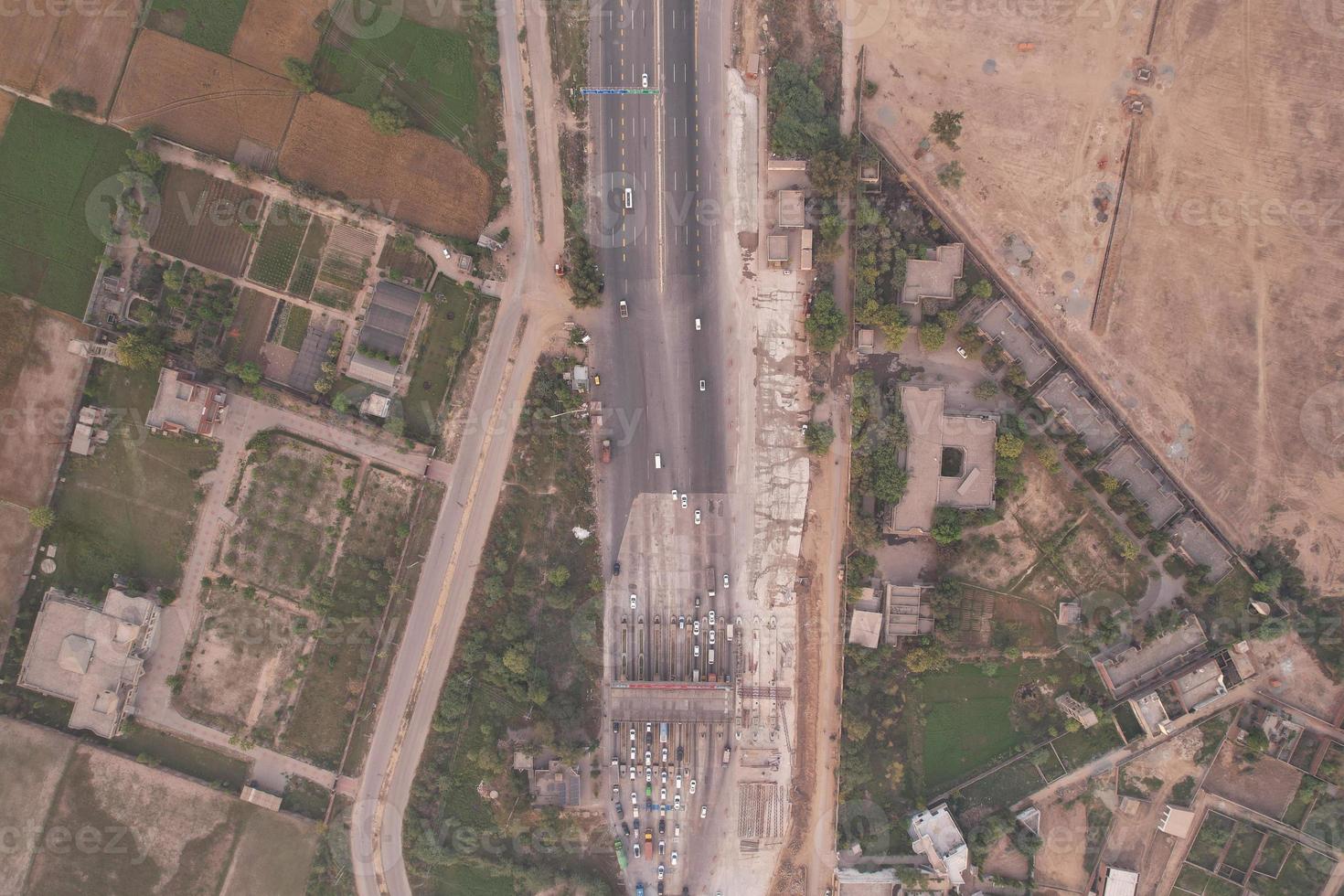 High Angle Footage and Aerial View of Pakistani Motorways M2 at Kala Shah Kaku Interchange to GT road Lahore, The Industrial Village of Punjab photo