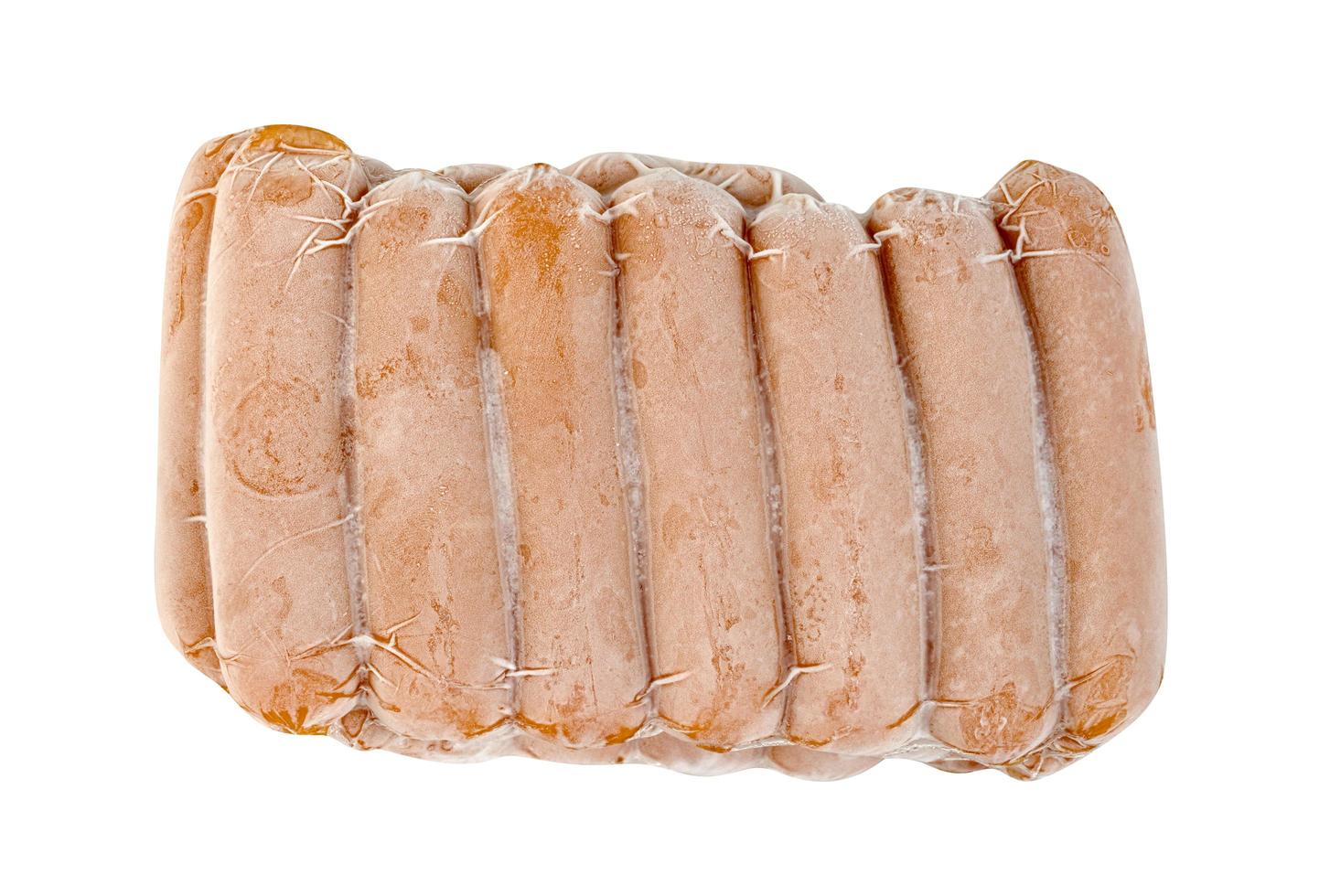 closeup frozen sausage in plastic bag with ice crystals isolated on white background photo