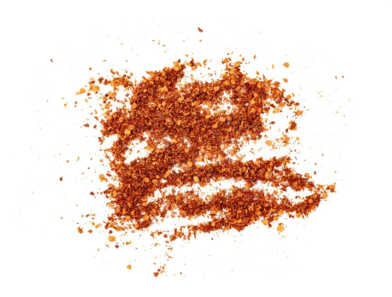 red ground paprika powdered or dry chili pepper isolated on white background photo