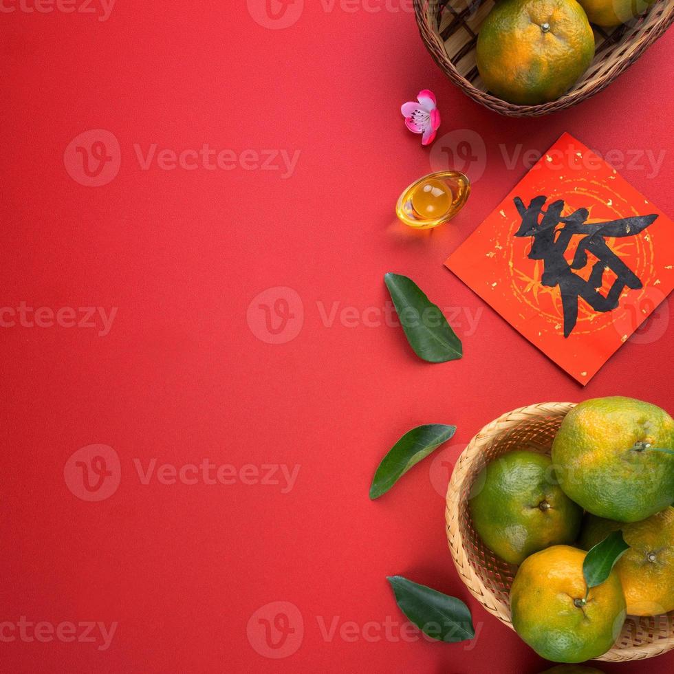 Top view of fresh tangerine mandarin orange on red background for Chinese lunar new year. photo