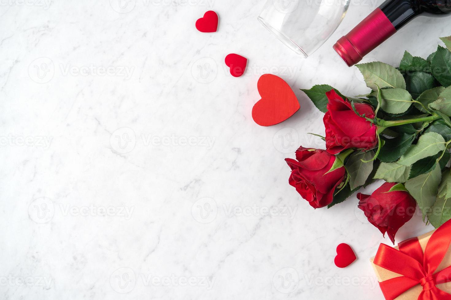 Top view of Valentine day gift with rose and wine, festive meal design concept photo