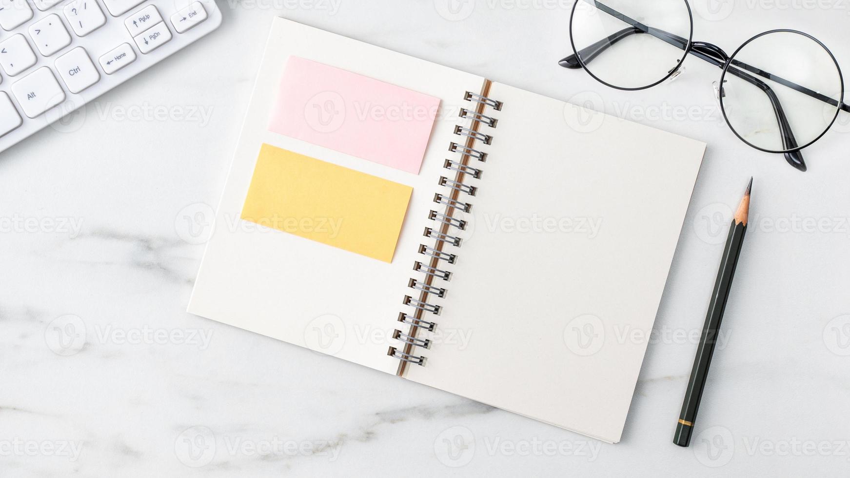 Top view of office table desk cozy work concept on bright marble white background. photo