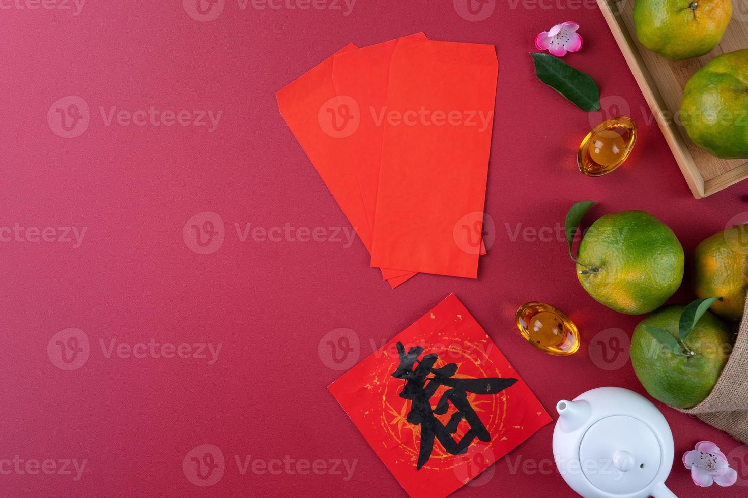 Top view of fresh tangerine mandarin orange on red background for Chinese lunar new year. photo