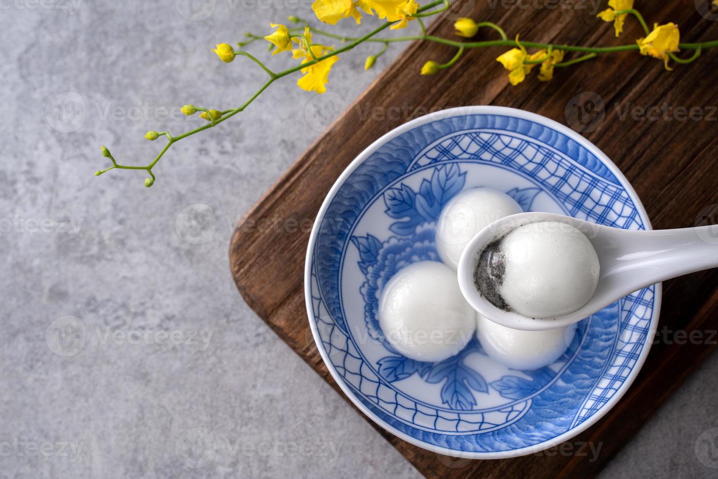 Top view of big tangyuan yuanxiao in a bowl on gray background for lunar new year food. photo