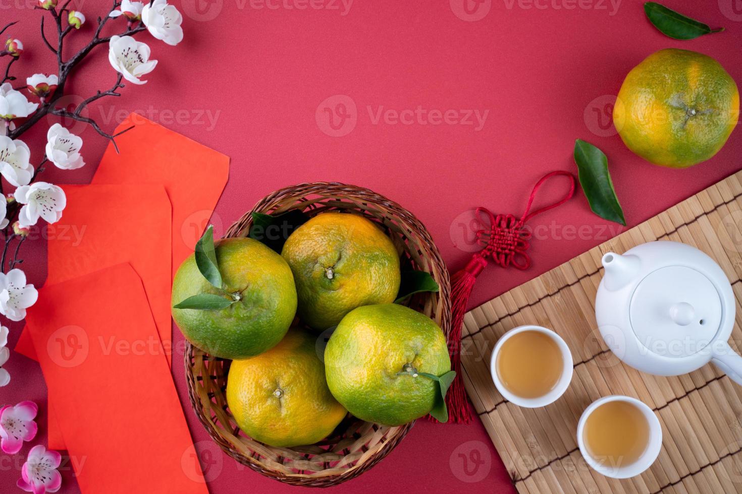 Top view of fresh tangerine mandarin orange on red background for Chinese lunar new year. photo