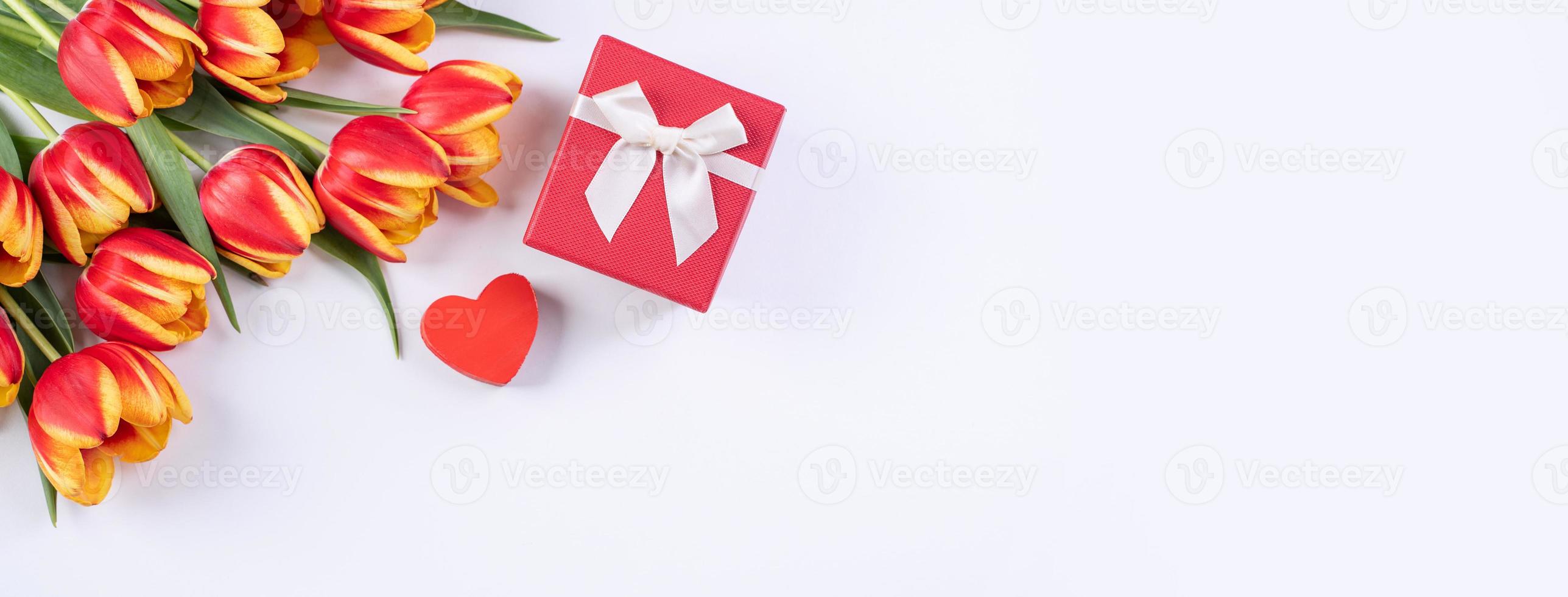 Tulips on white background of copy space, concept of Mother's day. photo