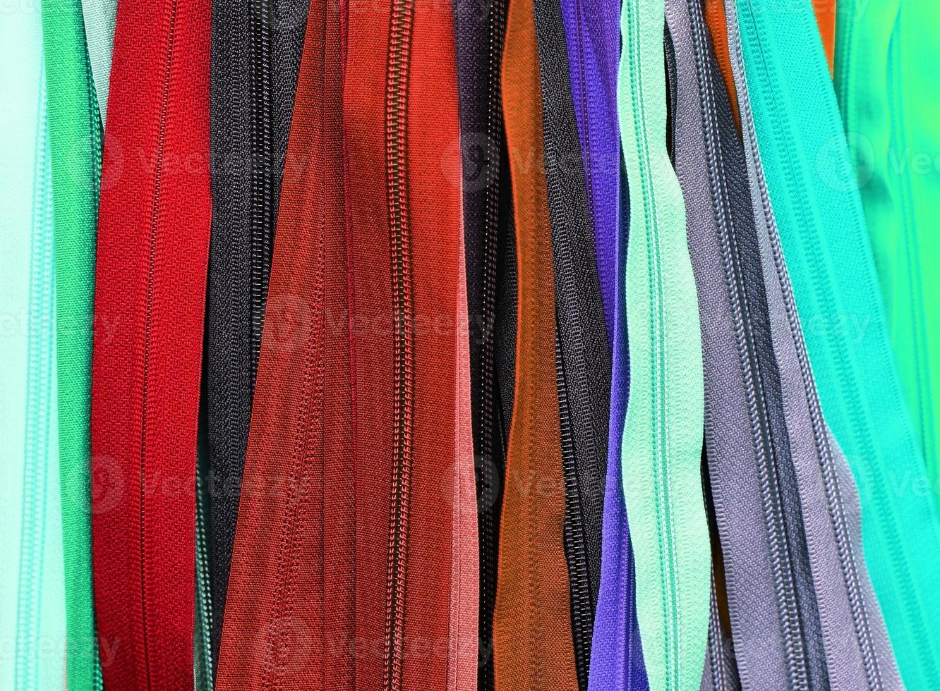 Detailed close up view on samples of cloth and fabrics in different colors found at a fabrics market photo