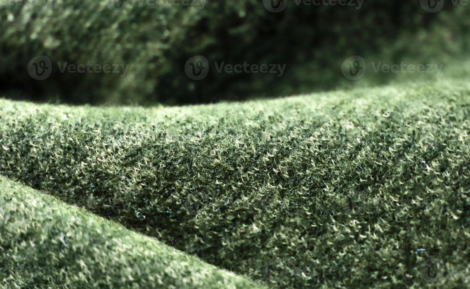 Detailed close up view on samples of cloth and fabrics in different colors found at a fabrics market photo