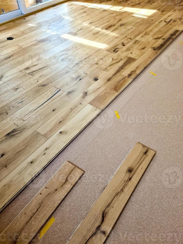 A parquet floor made of wood while it is being freshly installed. photo