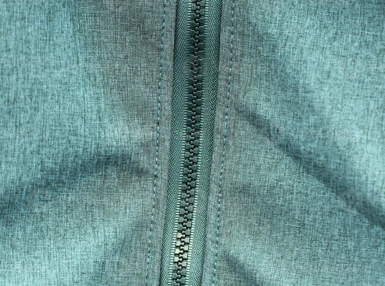 Detailed close up view on samples of cloth and fabrics in different colors found at a fabrics market photo