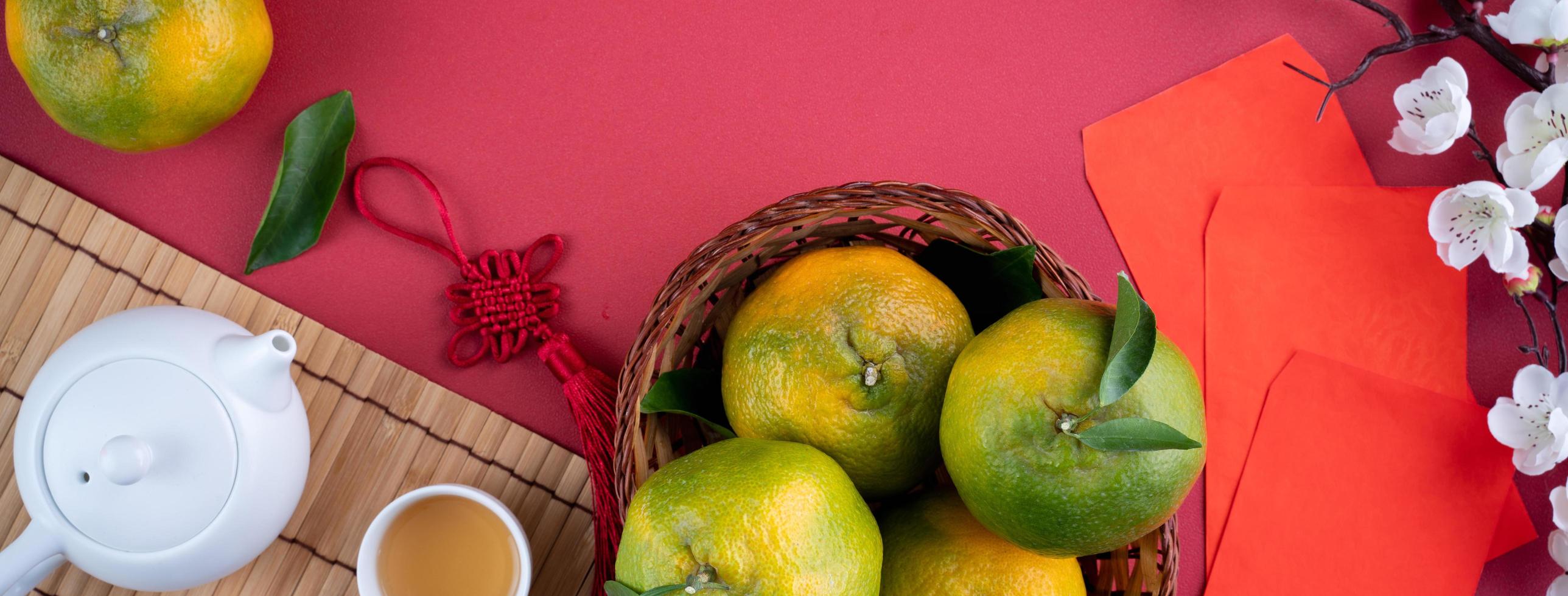 Top view of fresh tangerine mandarin orange on red background for Chinese lunar new year. photo