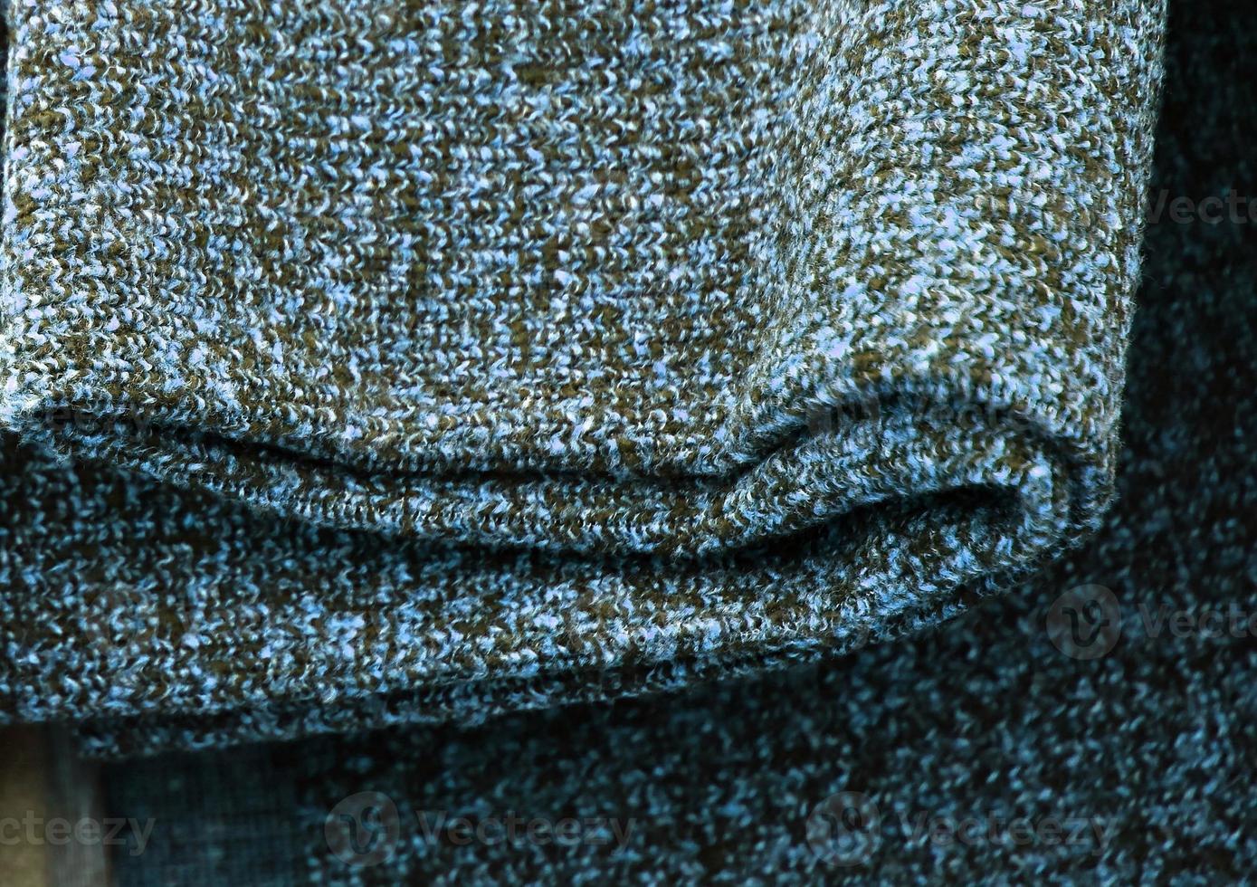 Detailed close up view on samples of cloth and fabrics in different colors found at a fabrics market photo