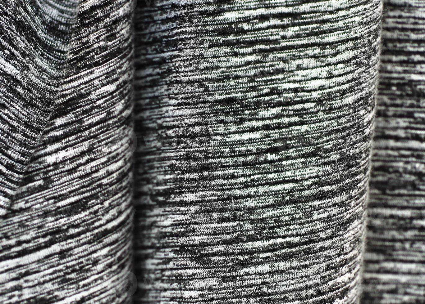 Detailed close up view on samples of cloth and fabrics in different colors found at a fabrics market photo