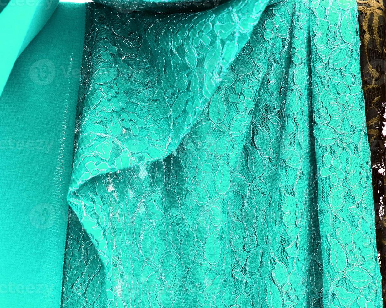 Detailed close up view on samples of cloth and fabrics in different colors found at a fabrics market photo