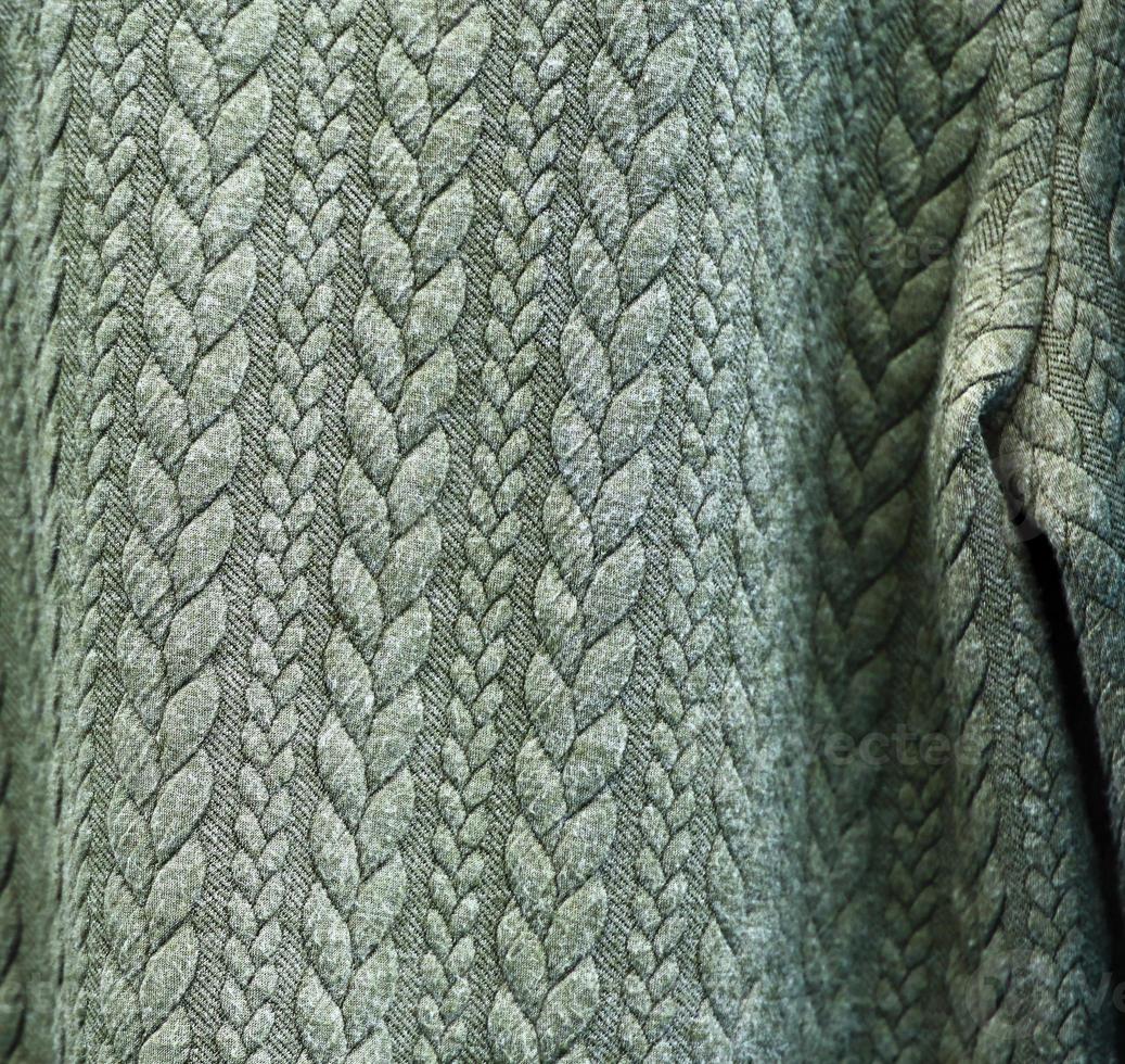Detailed close up view on samples of cloth and fabrics in different colors found at a fabrics market photo