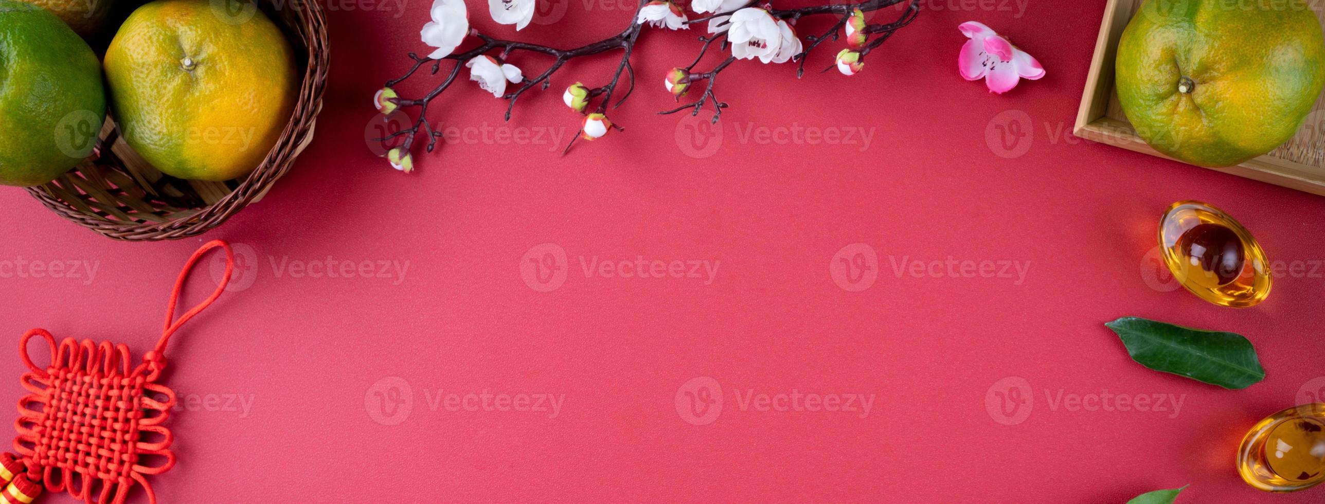 Top view of fresh tangerine mandarin orange on red background for Chinese lunar new year. photo