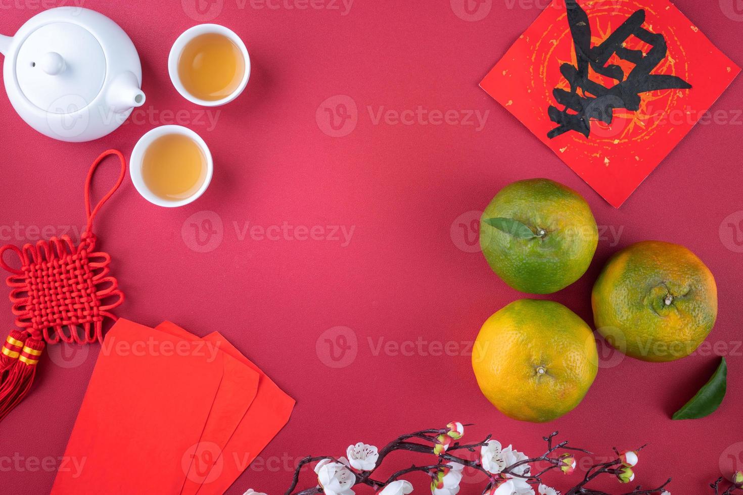Top view of fresh tangerine mandarin orange on red background for Chinese lunar new year. photo