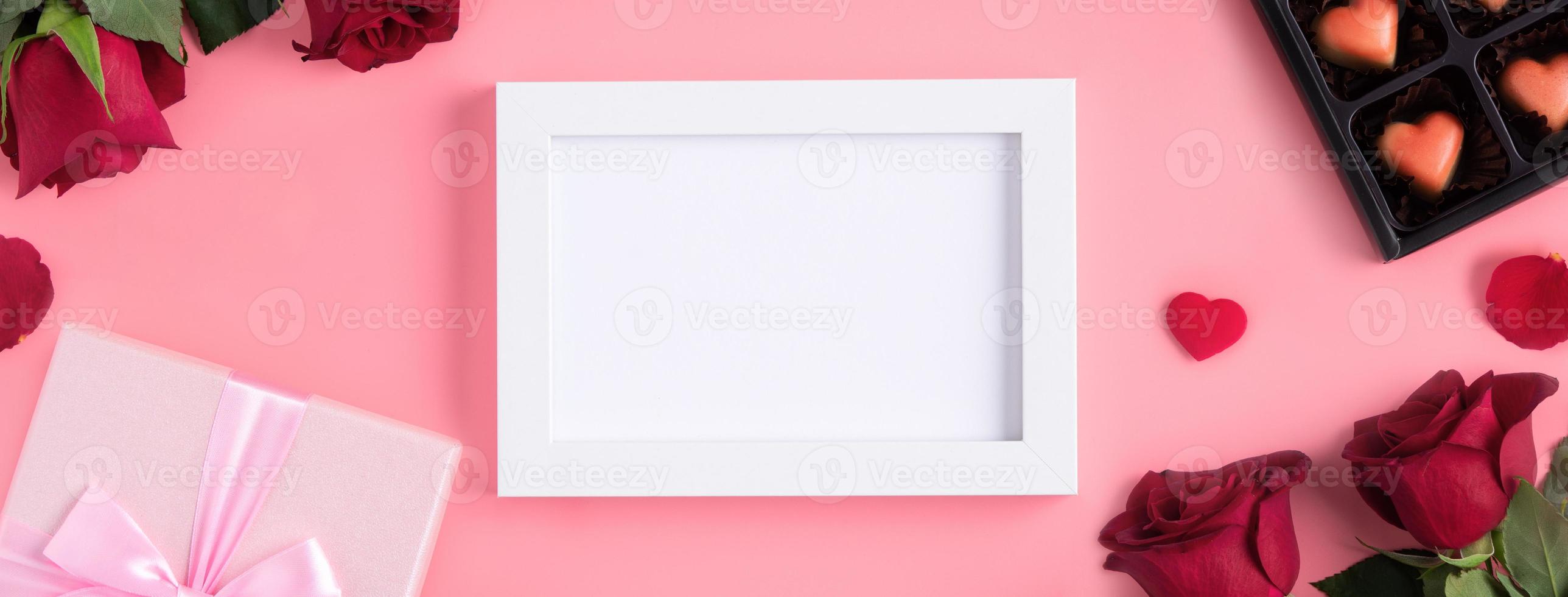 Valentine's Day memory with picture frame concept on pink background photo