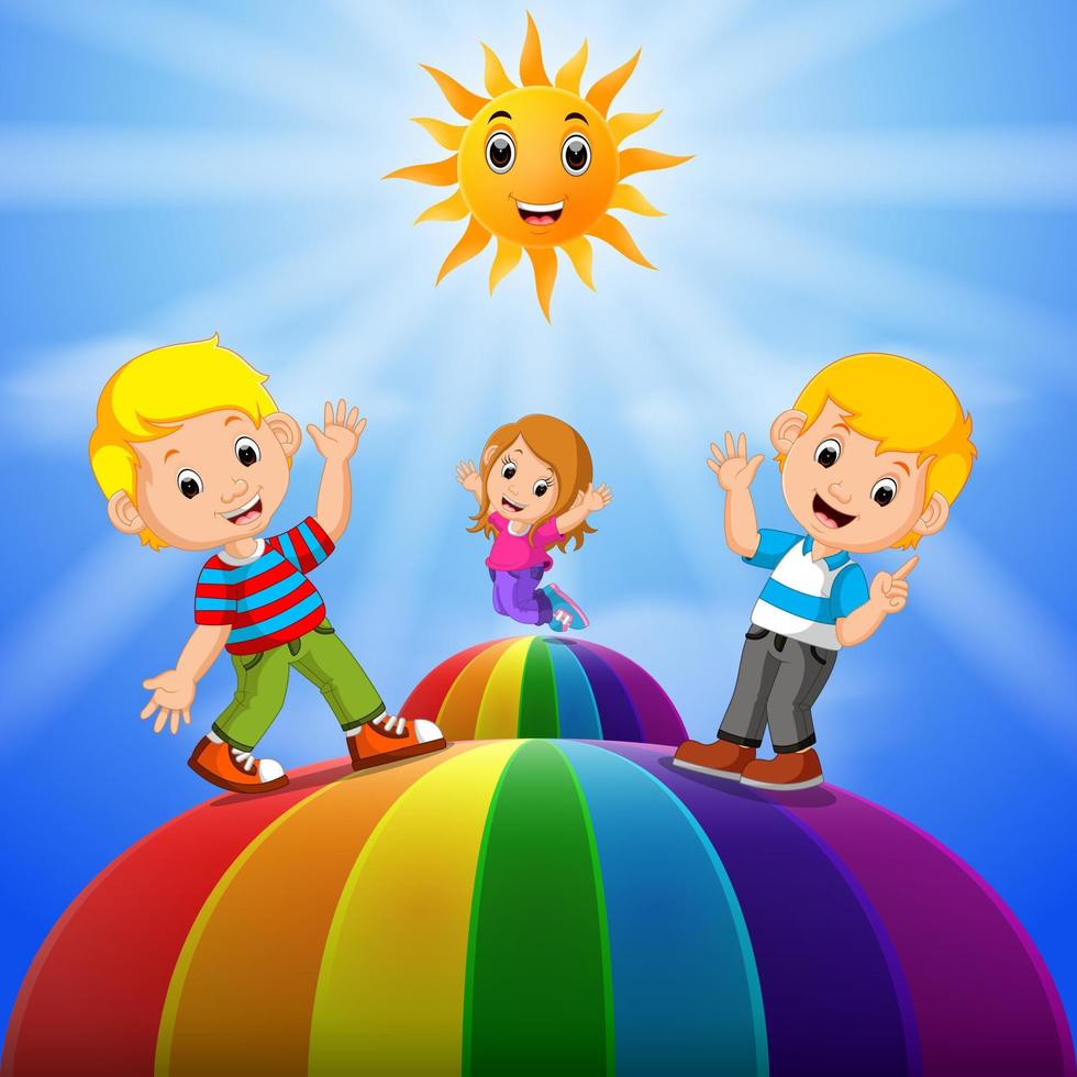 Happy kids standing over the rainbow vector