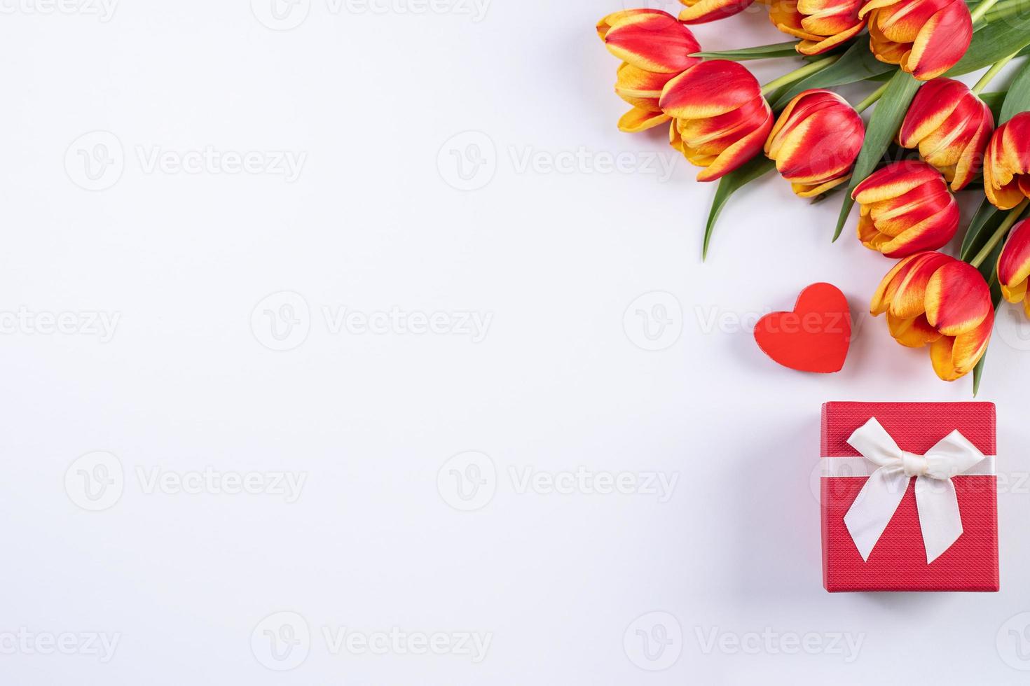 Tulips on white background of copy space, concept of Mother's day. photo