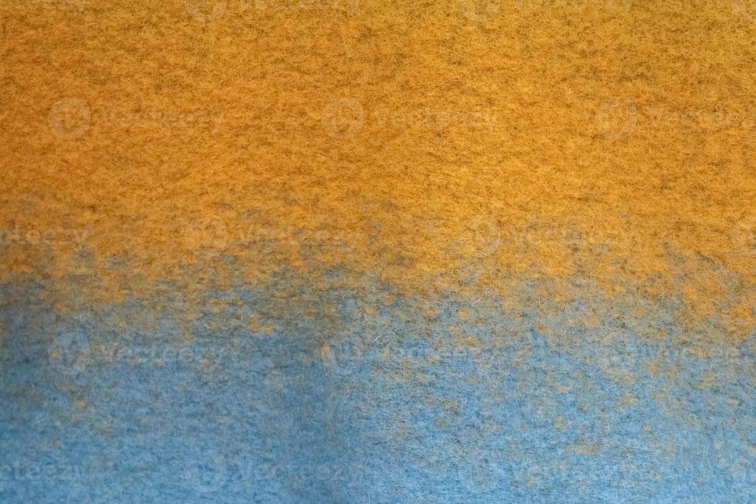 Detailed close up view on samples of cloth and fabrics in different colors found at a fabrics market photo