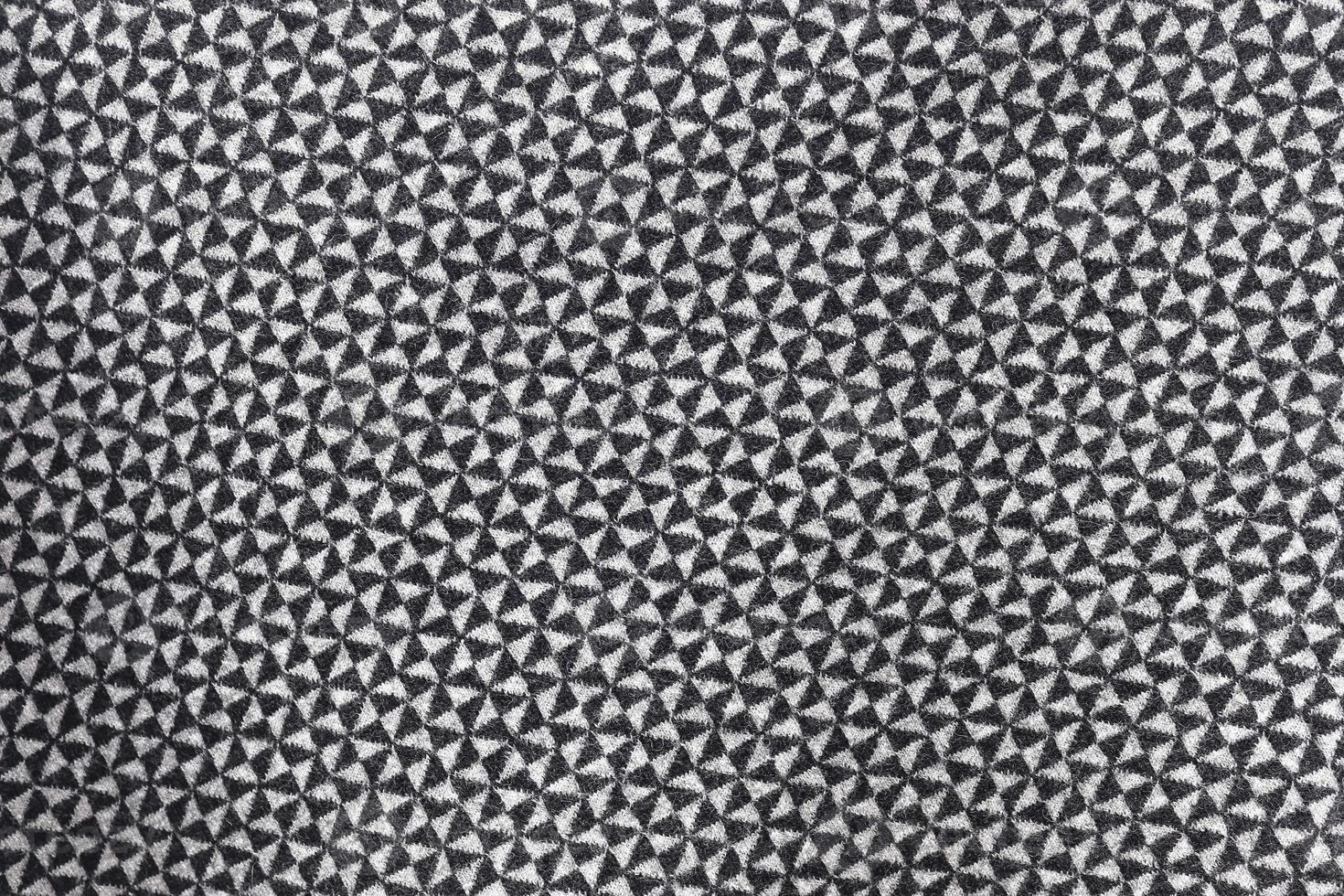 Detailed close up view on samples of cloth and fabrics in different colors found at a fabrics market photo