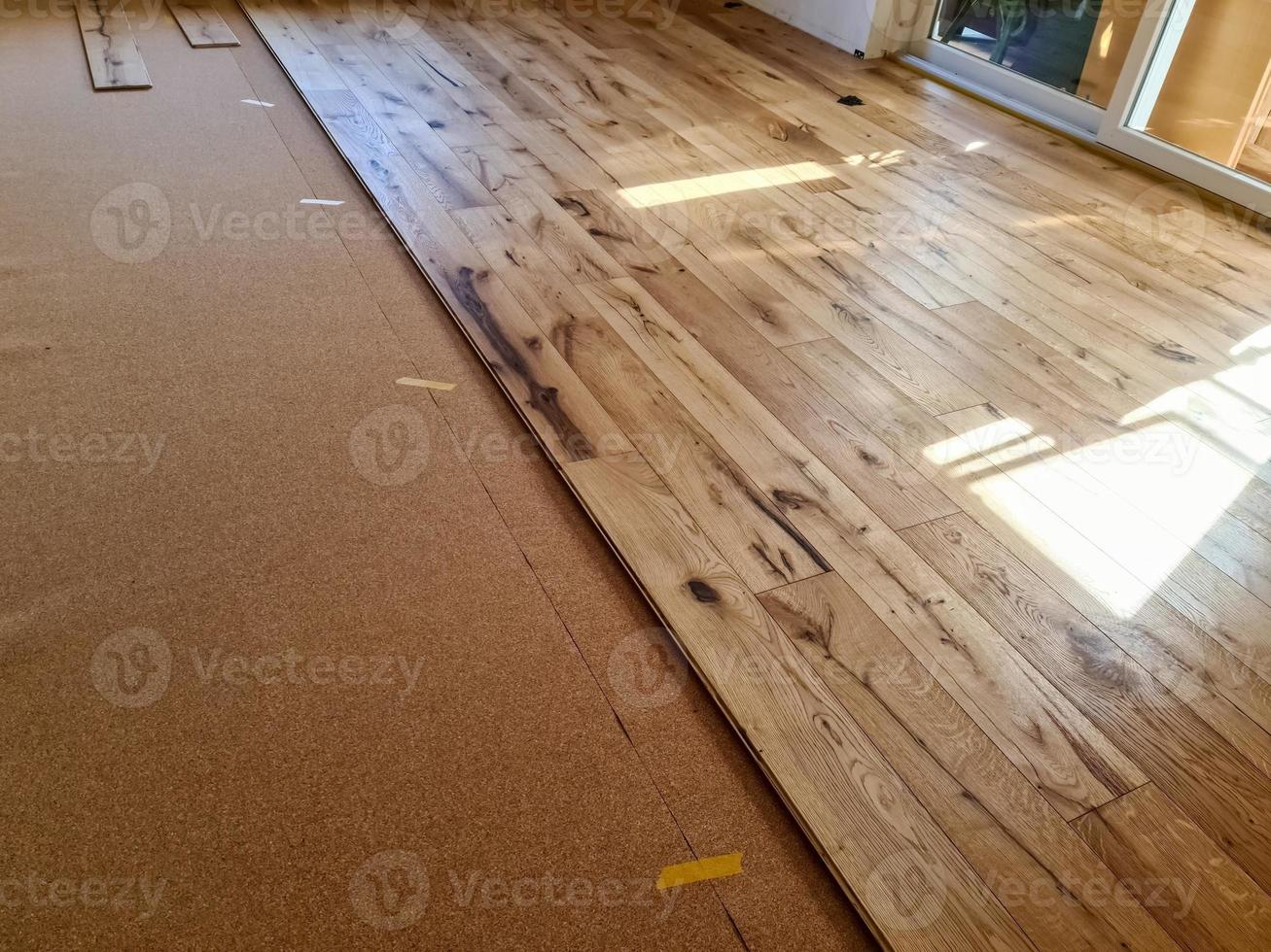 A parquet floor made of wood while it is being freshly installed. photo