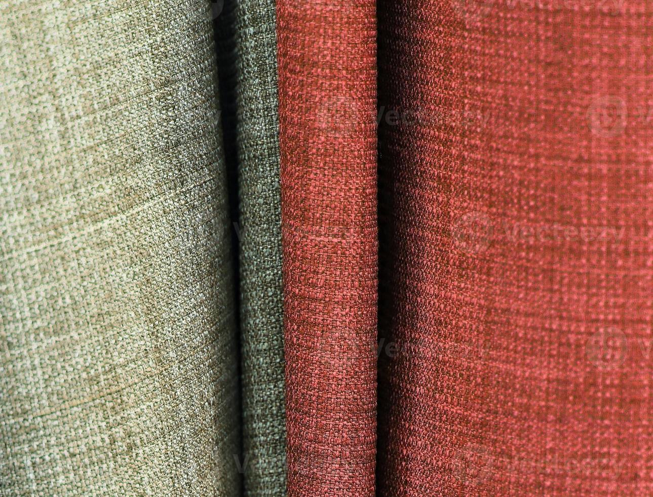Detailed close up view on samples of cloth and fabrics in different colors found at a fabrics market photo