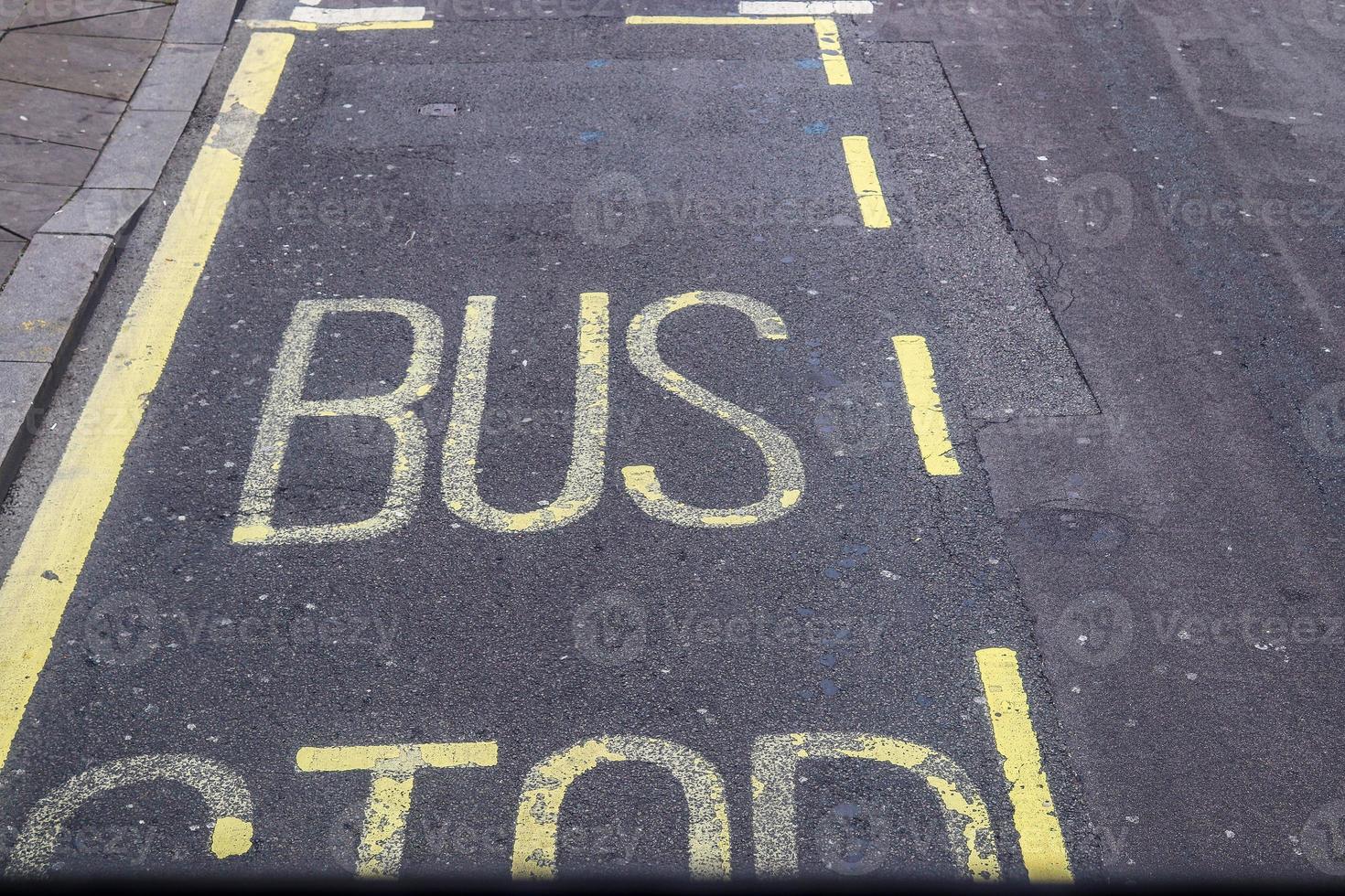 Different signs and marking painted on the ashpalt of streets and roads. photo