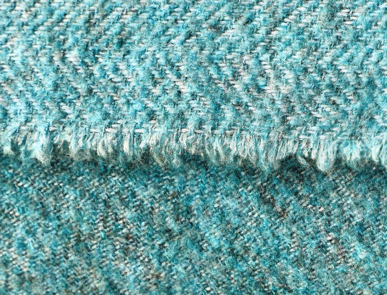 Detailed close up view on samples of cloth and fabrics in different colors found at a fabrics market photo