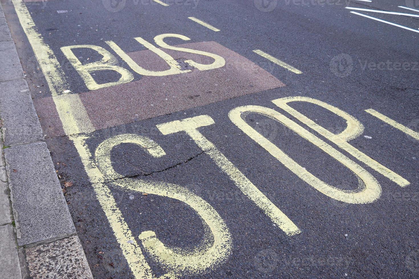 Different signs and marking painted on the ashpalt of streets and roads. photo