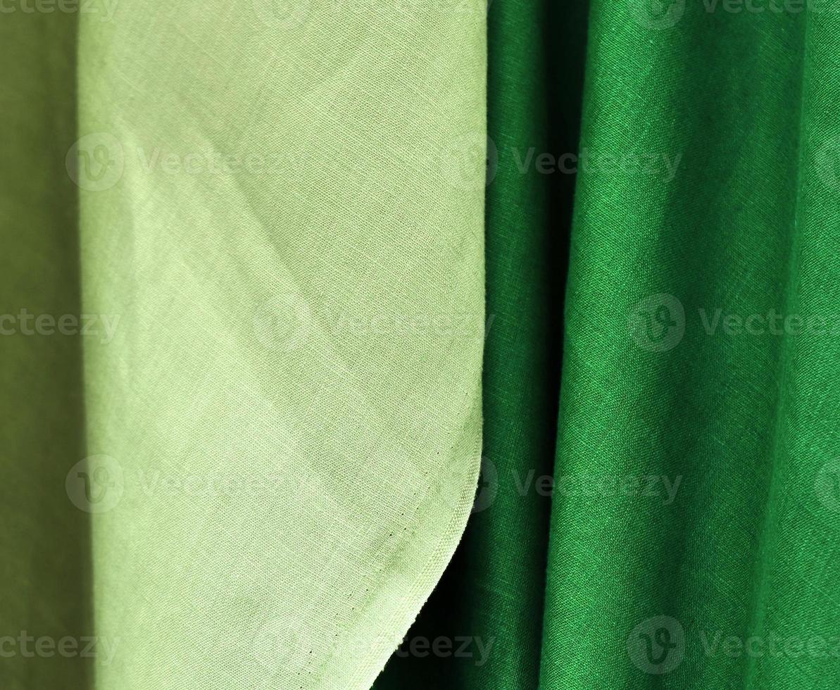 Detailed close up view on samples of cloth and fabrics in different colors found at a fabrics market photo