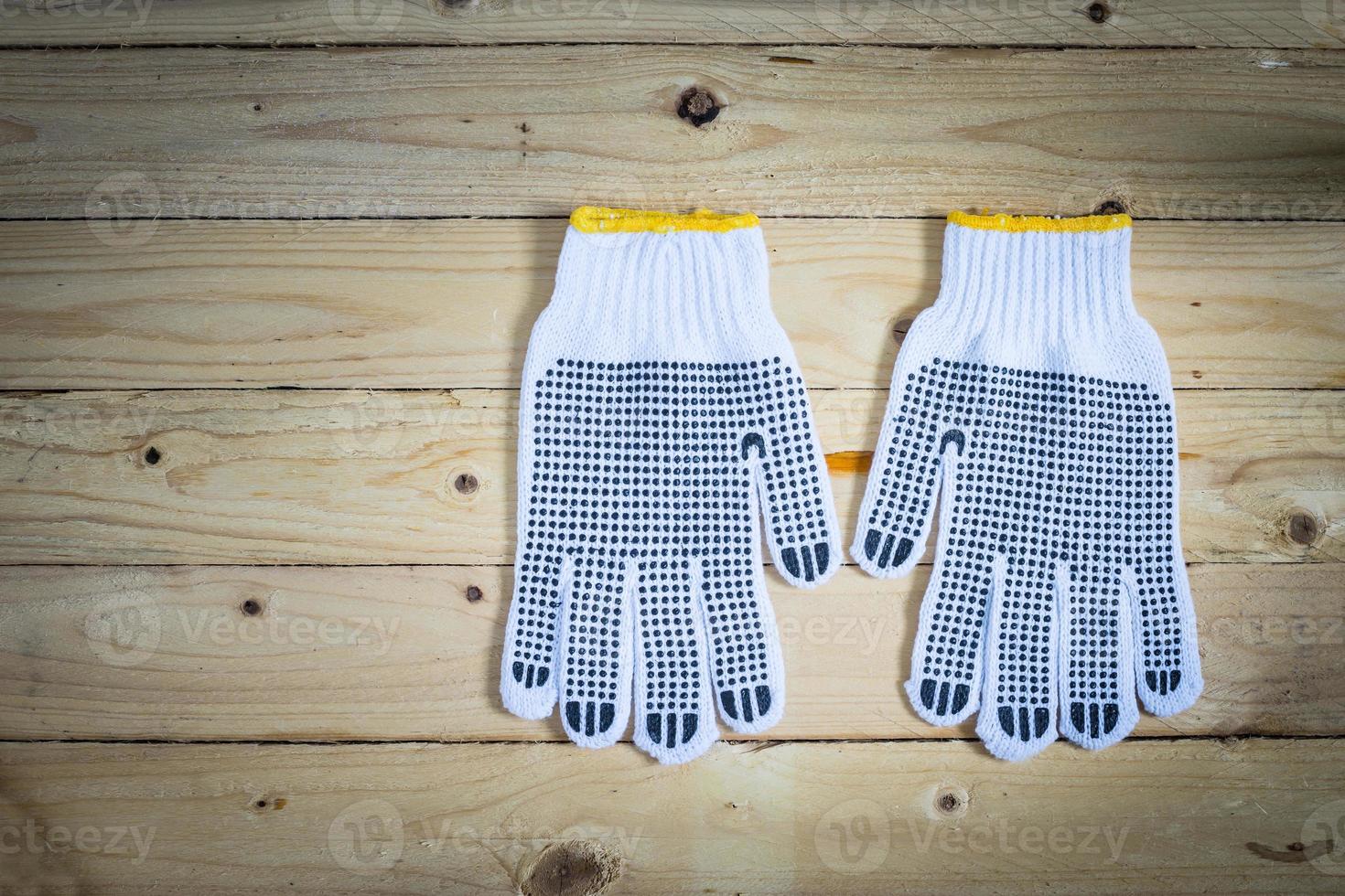 Gloves on wooden background photo
