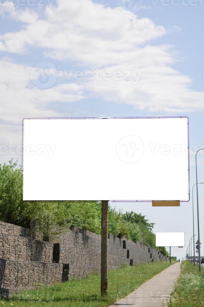 Billboard white blank with room to add your own text. Background with white cloud and blue sky for outdoor advertising, banners with clipping path photo