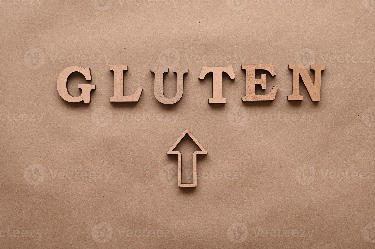 Gluten.Text in block letters on a paper background. Free space for design. photo