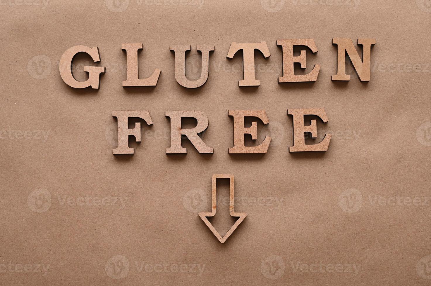 Letters Gluten free on a paper background. photo
