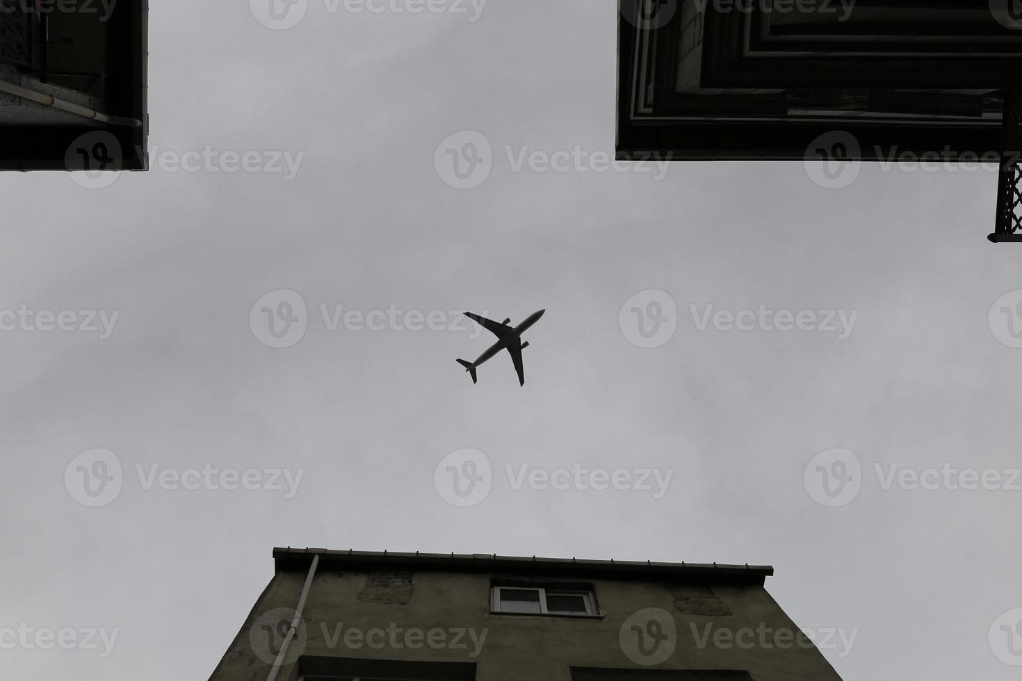 Airplane passing over Fener District in Istanbul, Turkey photo