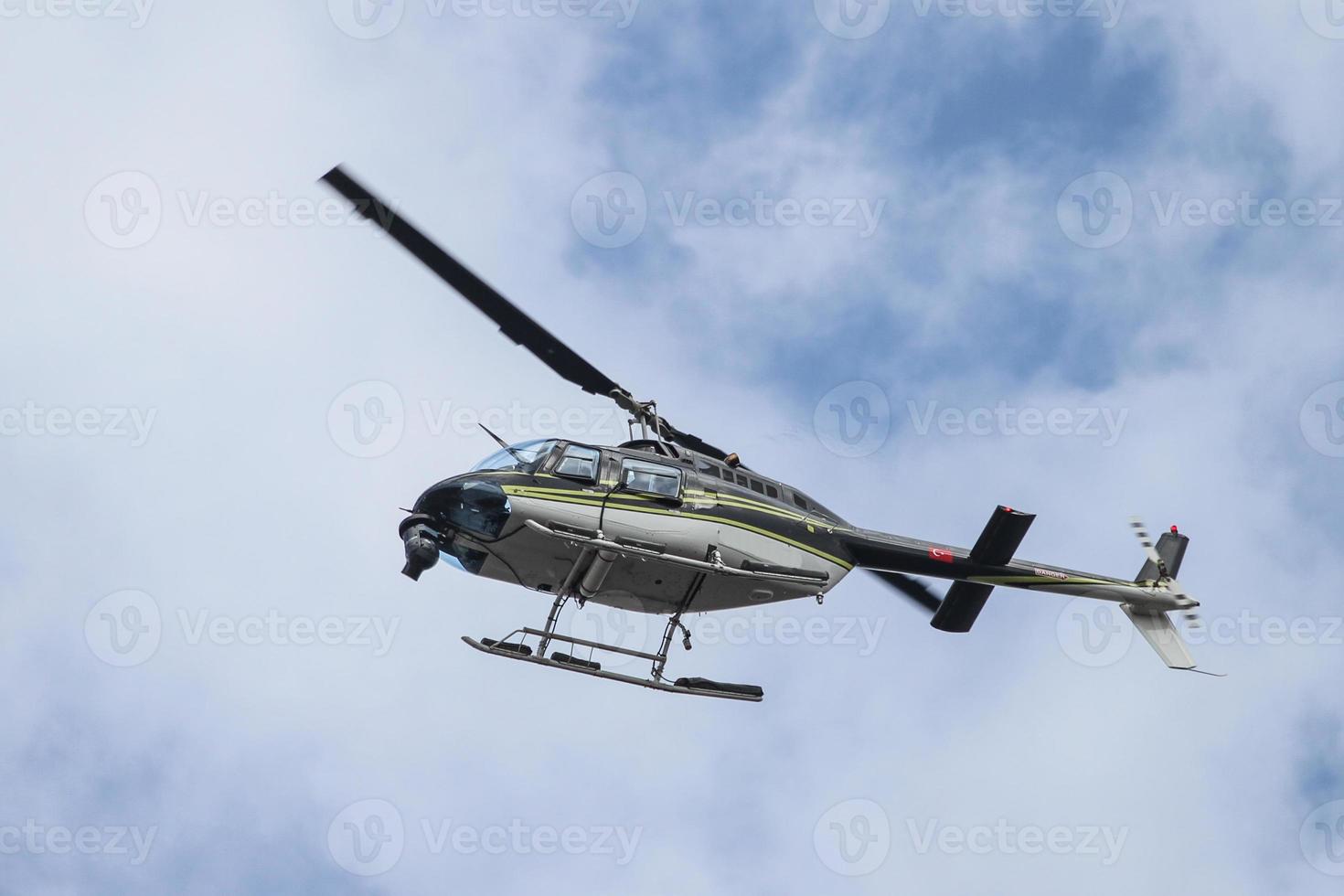 Black and White Helicopter flying over Istanbul City photo