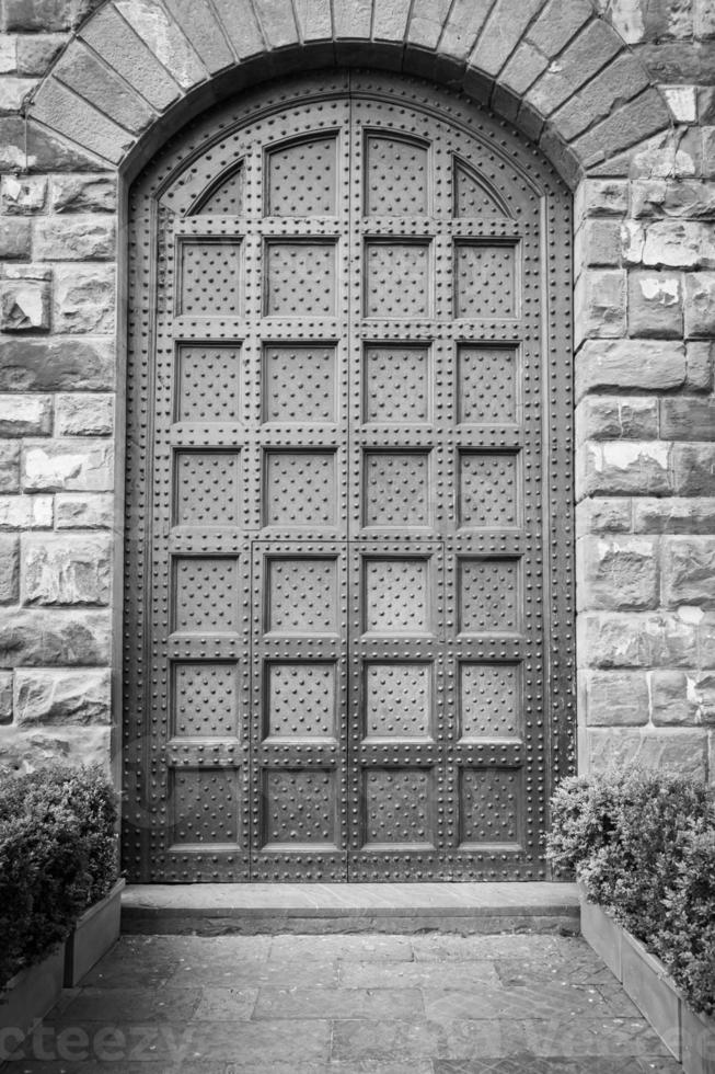 Antique door in historical building - Concept of security, mystery, grunge. photo