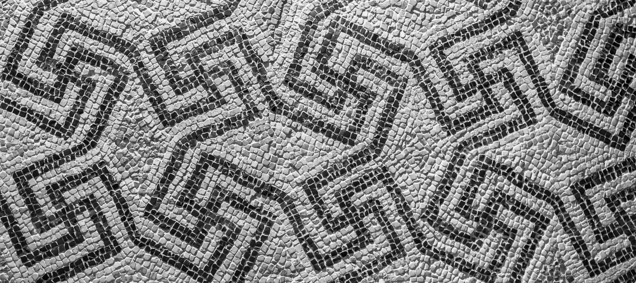 Swastika symbol in ancient Celtic mosaic decoration. Design for an old style background. photo