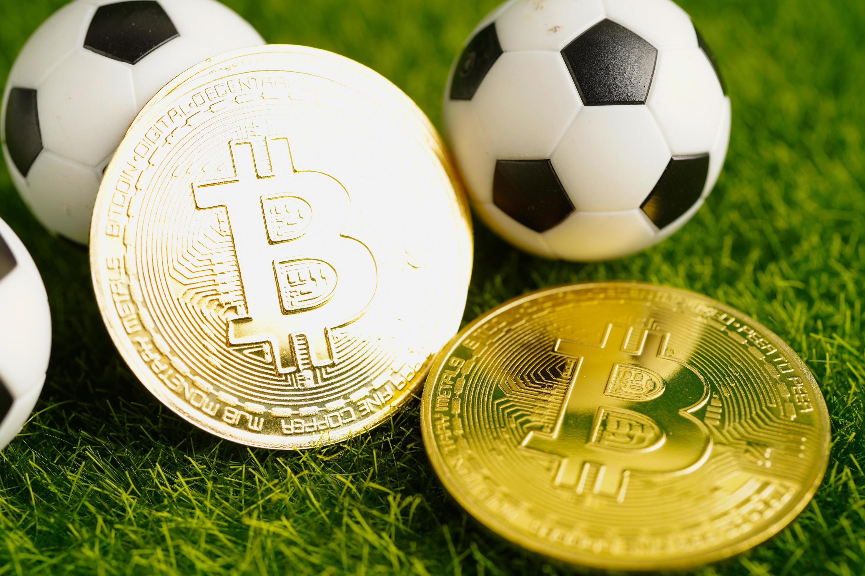 Gold bitcoin with soccer ball or football, cryptocurrency used in online sports betting