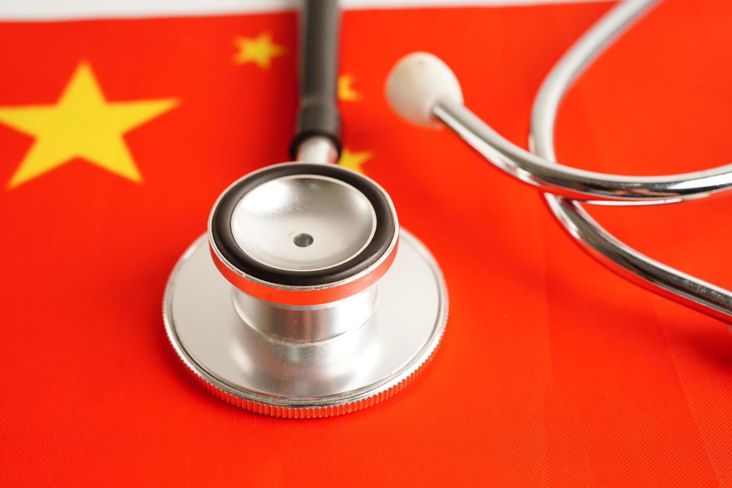 Black stethoscope on China flag background, Business and finance concept. photo