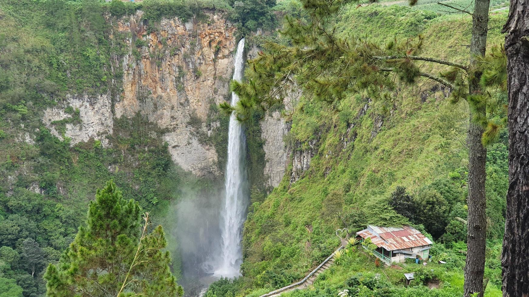 Waterfall in the middle of the hill photo