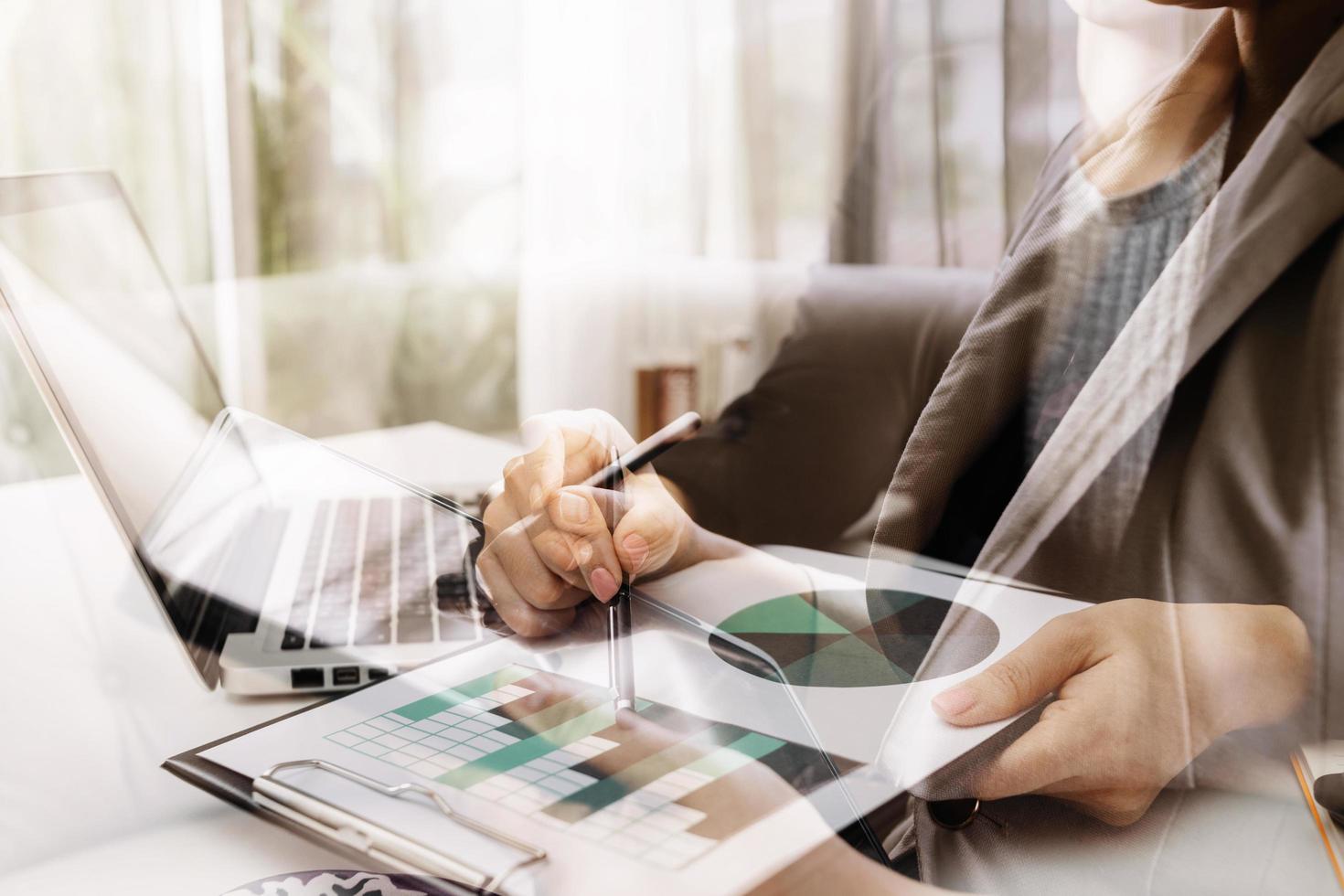 Businessman and team analyzing financial statement Finance task. with smart phone and laptop and tablet. Wealth management concept photo